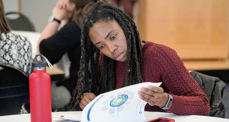 Postdoc reviewing orientation packet