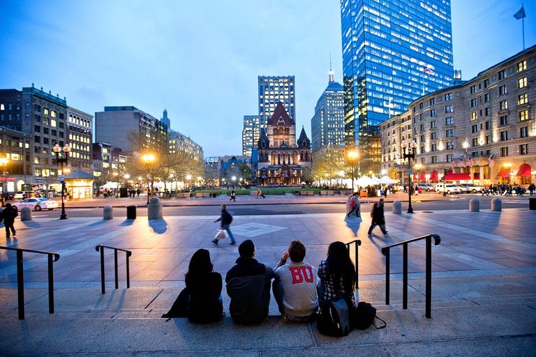 students sitting on steps outdoors in boston