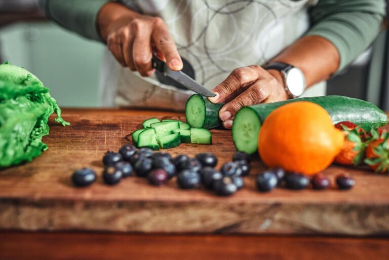 Person cutting vegetables