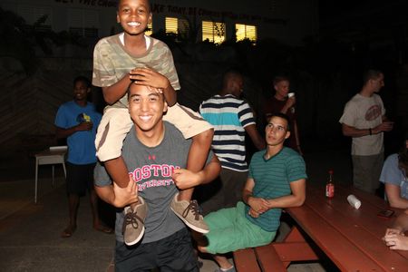 A BU Cadet with a local child during his CLUP mission.