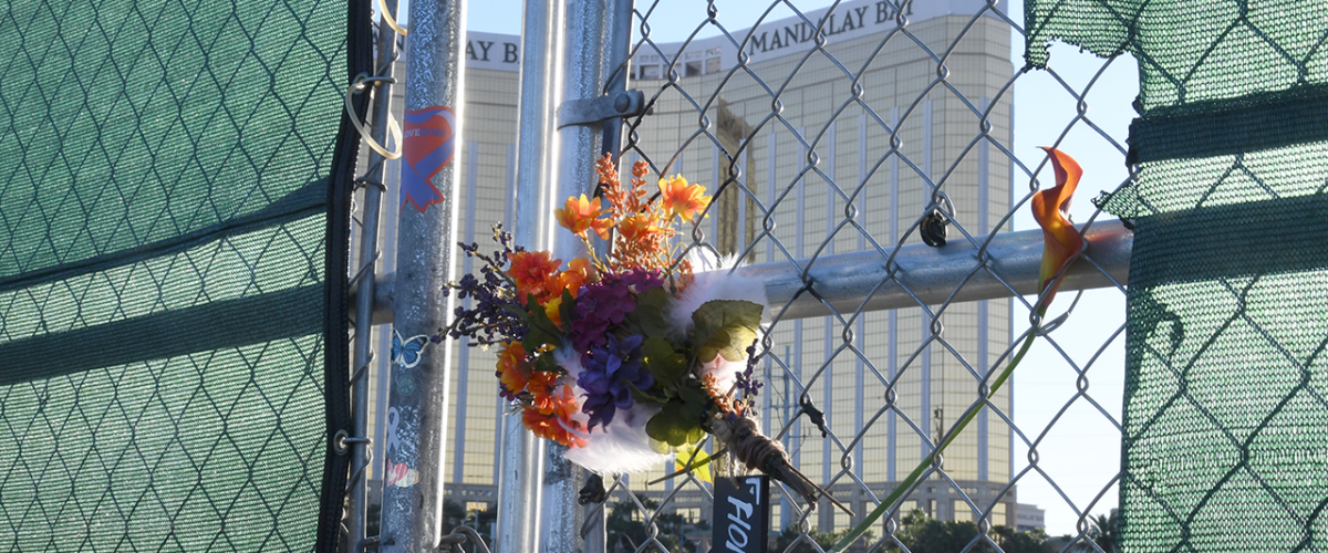 Bouquet of flowers hangs on a chainlink fence in Las Vegas, NV