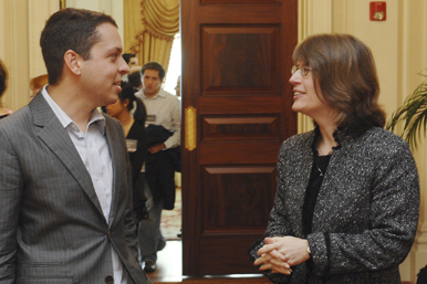 Markos Moulitsas (LAW'99) talks with Maureen O'Rourke, dean of the School of Law, at the conference New Media and the Marketplace of Ideas. Photo by Vernon Doucette