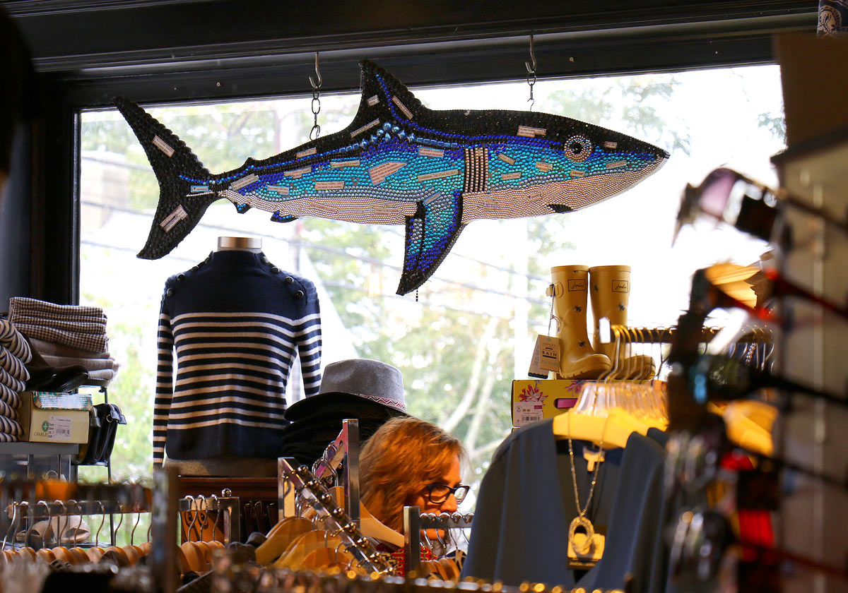 A BU expert suggests businesses avoid “shark tourism,” like this artwork in a Chatam store in 2017, after last summer’s tragedy. Photo by John Tlumacki/The Boston Globe via Getty Images
