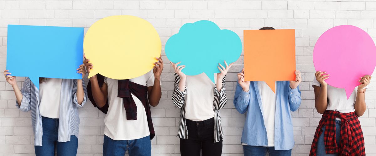 5 people against a white wall with blank caption bubbles in front of their faces