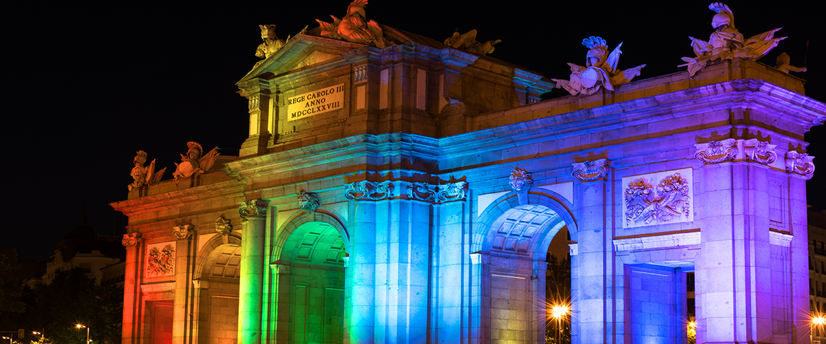 rainbow lights on a stone gate