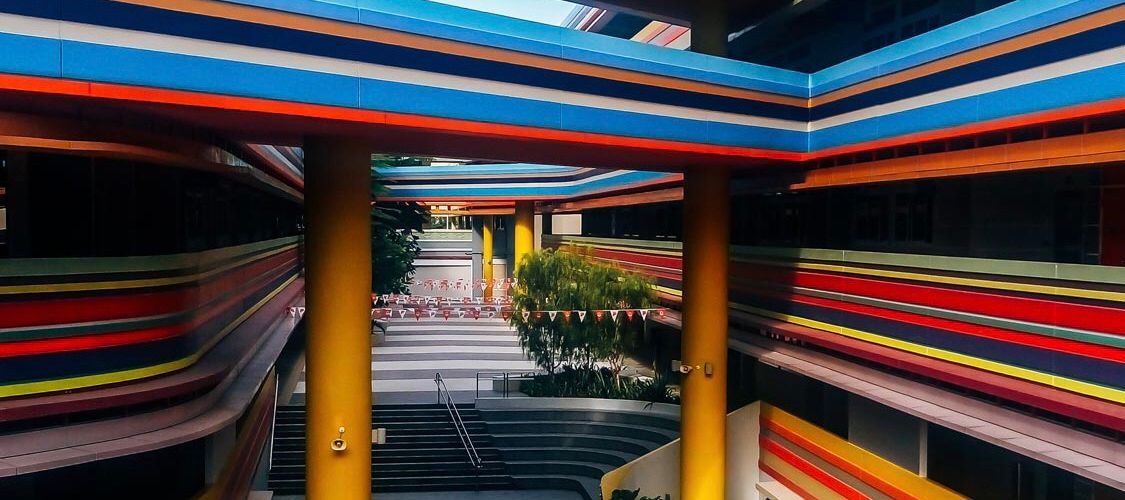 Building with continous clorful balconies and pillars in Singapore