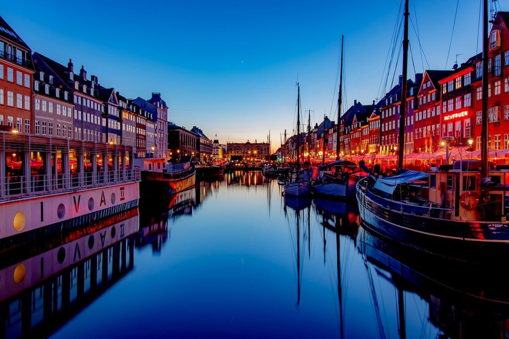 boats in Copenhagen harbor at sunset