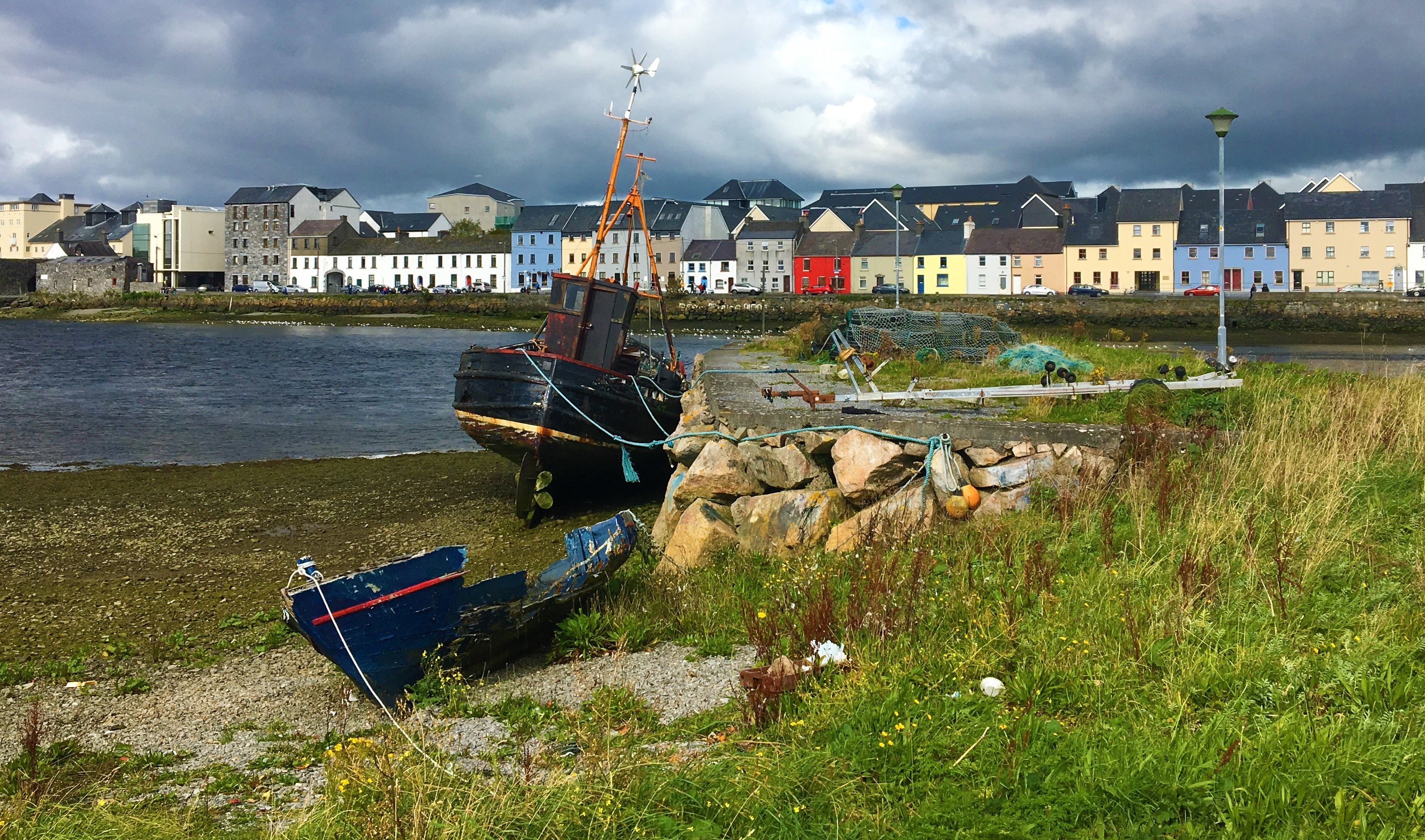 Village of galway viewed from harbor with grounded fishing boat