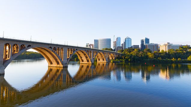 Key Bridge over Potomac River with urban skyline
