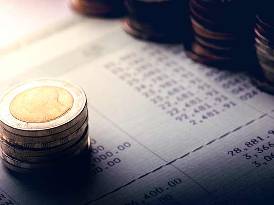 international coins representing tariff regulations