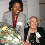African American Studies Program Director Linda Heywood presents Professor Emerita Adelaide M. Cromwell with a gift in gratitude for her contributions to Boston University