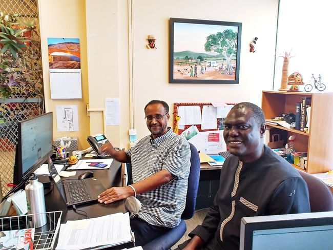 ASL Librarian Gabe Adugna seated with Mr. Sarr at the African Studies Library