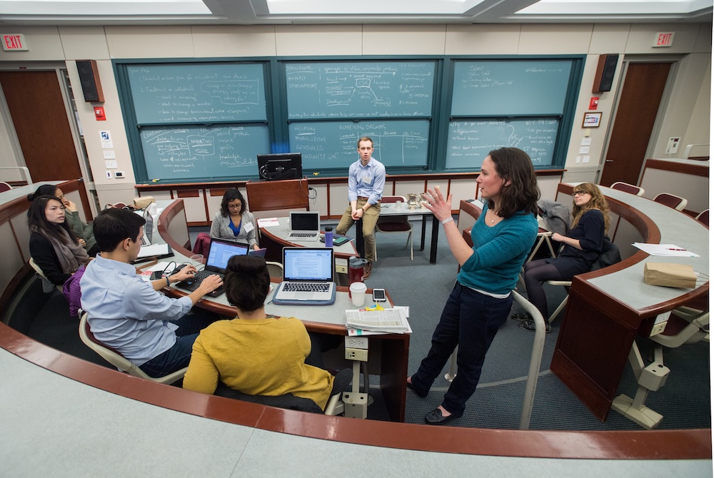 Students engaged in conversation in classroom