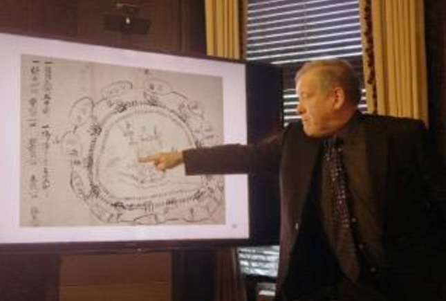 Professor Stephen Turnbull points out to his audience at the Pardee School details of the samurai siege of wooden palisade Tanaka Castle on a period map.