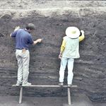 Bob Murowchick and Leng Jian clean a profile in a trench at Shantaisi (1996).