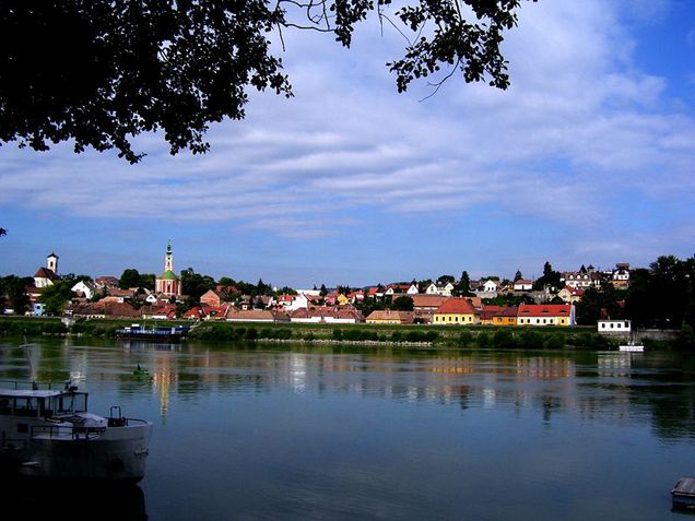 Szentendre is a small Hungarian town near the Danube bend, framed in a picturesque, natural setting with the winding river, nearby hills and mountains.