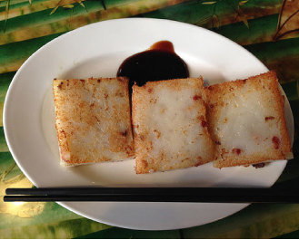 Pan fried Daikon cakes studded with pork and served with plum sauce (Bubor Cha Cha in Chinatown, Boston)