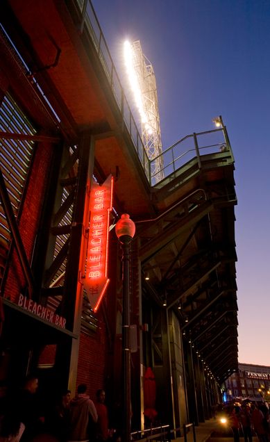 From Lansdowne Street, the glowing Bleacher Bar sign invites fans and tourists in for a unique experience