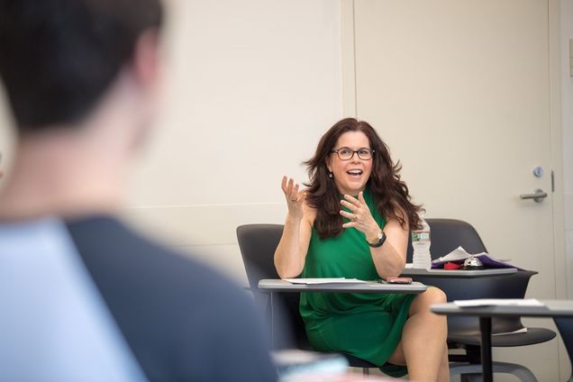 Lively class discussion of student presentations is a trademark of Leora Lanz, an SHA lecturer. Photo by Cydney Scott