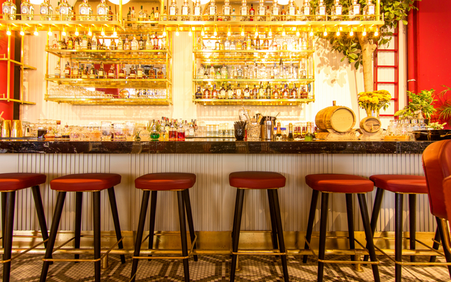 Empty barstools at a restaurant bar