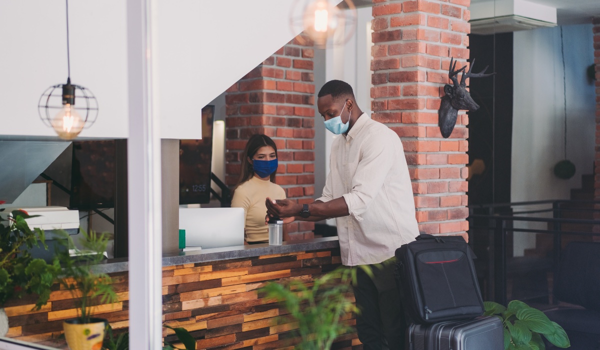 Man Checking in at Hotel