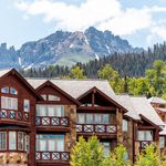 Telluride, Colorado small town Mountain Village in summer 2019 with view of San Juan Mountains and modern resort lodge apartment condo architecture