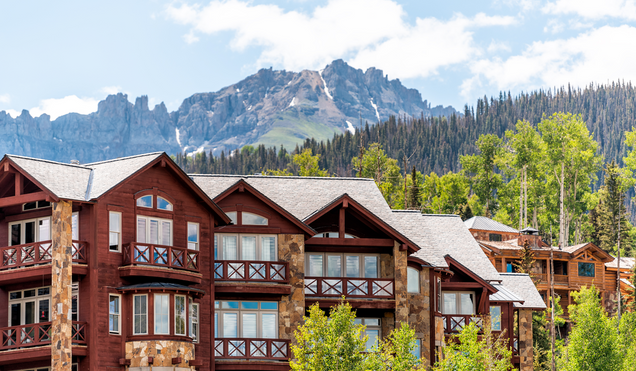 Telluride, Colorado small town Mountain Village in summer 2019 with view of San Juan Mountains and modern resort lodge apartment condo architecture