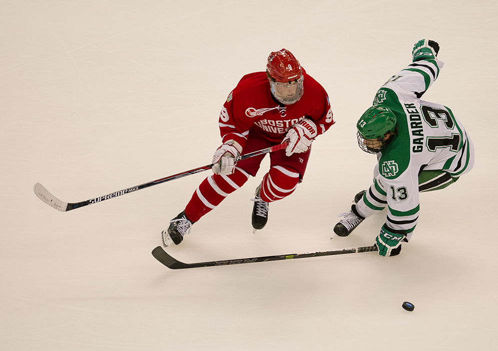 Jack Eichel (CGS'16) goes after the puck, with North Dakota's Connor Gaarder on his heels, during the second period of the 2015 Frozen Four semifinal at TD Garden last night. Eichel scored two goals in the game. <em>Photo by Jackie Ricciardi</em>