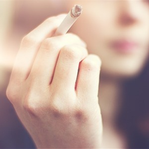 Girl with cigarette in hand