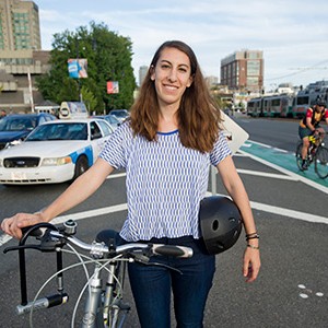 Carly Sitrin (COM'17)  talking bike safety on Commonwealth Ave Boston