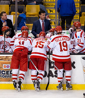 BU Terriers ice hockey coach David Quinn talks to players on the bench during the 2015 Hockey East Championship Semifinals