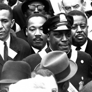 Gil Caldwell (STH’58) (left) joins Martin Luther King, Jr. (GRS’55, Hon.’59) in a protest against segregation in Boston schools on April 23, 1965. The protesters marched from the predominantly African American neighborhood of Roxbury to the Boston Common, where King gave a speech. The event is one among many marches and protests for justice Caldwell has participated in over the years. Photo courtesy of AP Photo