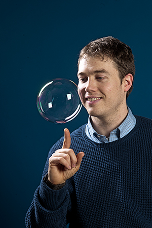 Studio portrait of James Bird assistant professor, mechanical engineering for Bostonia Magazine.