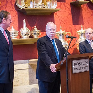 Board of Trustees chairman Robert A. Knox, President Robert A. Brown, and campaign chairman Kenneth J. Feld speak during a Board of Trustees dinner