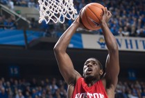 Professional basketball player John Holland shoots a basket while he was a college player with the BU Terriers