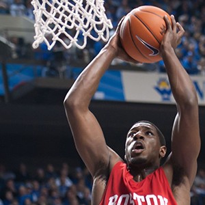 Professional basketball player John Holland shoots a basket while he was a college player with the BU Terriers