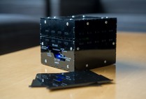 Close-up photo of the prototype zika virus diagnostic test, reader and paper tests
