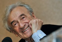 Elie Wiesel smiles during a news conference in Budapest, Hungary.