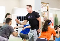 Personal trainer Walter Norton, Jr. working with high school students at Institute of Performance and Fitness