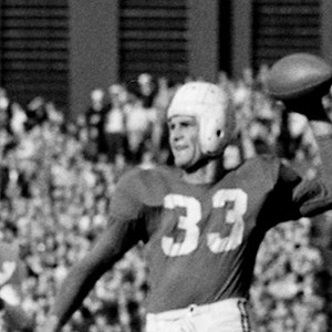 Harry Agganis drops back to pass during a Boston University vs University of Maryland football game at Fenway Park, 1952