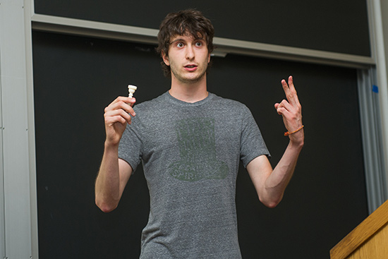 Boston University undergraduate researcher David Baylies delivers a presentation about the electronic trumpet he is building for his Undergraduate Reserarch Opportunites Program project