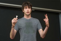 Boston University undergraduate researcher David Baylies delivers a presentation about the electronic trumpet he is building for his Undergraduate Reserarch Opportunites Program project