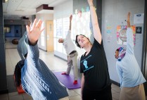 Susan Lovett (SSW’98) teaches yoga class