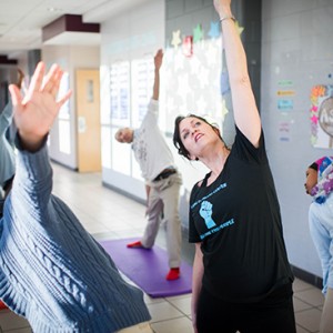 Susan Lovett (SSW’98) teaches yoga class