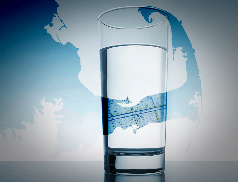 glass of drinking water in front of a map of Cape Cod, Massachusetts