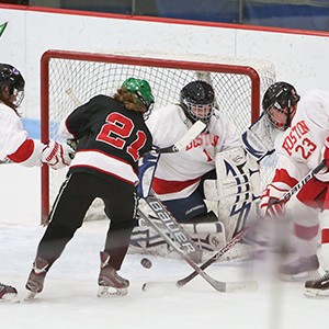 Lindsay Hulley defends the goal during a hockey game