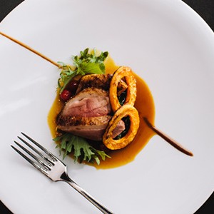 photo of duck breast and squash rings on a plate