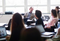 Steve Quigley sitting in front of his class