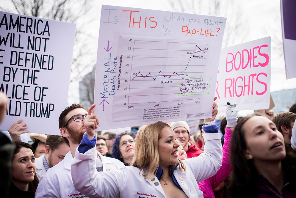 Boston University School of Medicine student Andrea Foster holds a Pro-Choice Pro-Abortion sign in the Boston Women's March for America