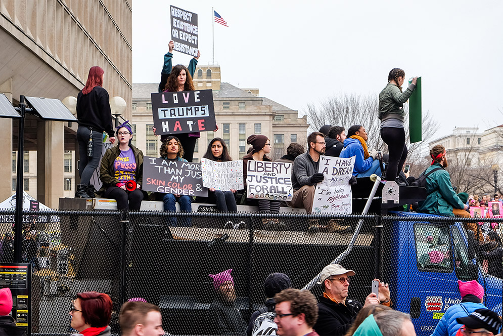 March participants listen to speakers during the Women's March on Washington